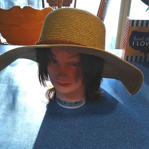 Angela William straw hat